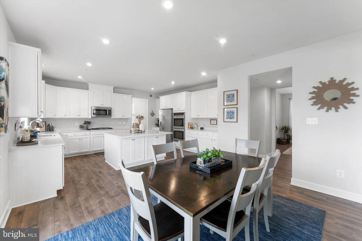 Dining room, Interior, Kitchen, Recessed Lighting, Stainless Steel Appliances, Wood Texture Flooring