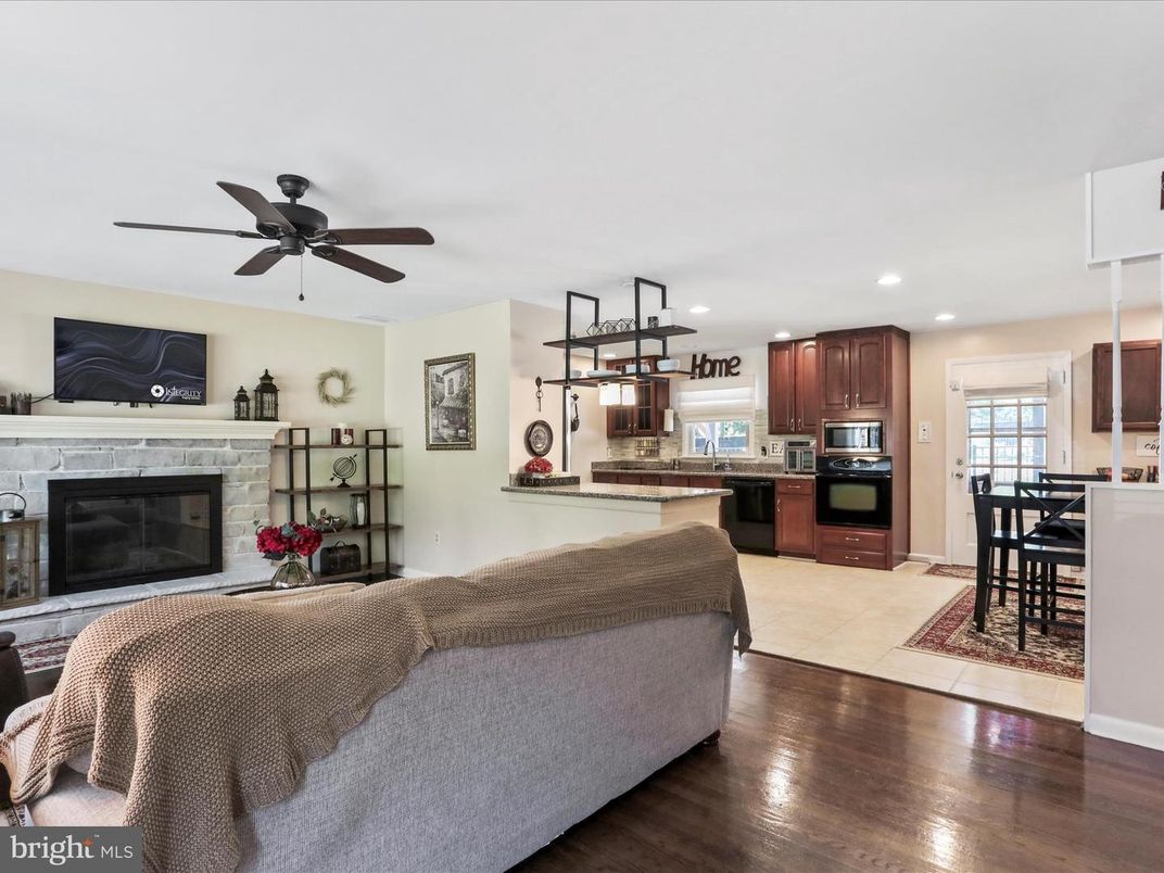 Dining room, Fireplace, Interior, Kitchen, Living room, Recessed Lighting, Wood Texture Flooring