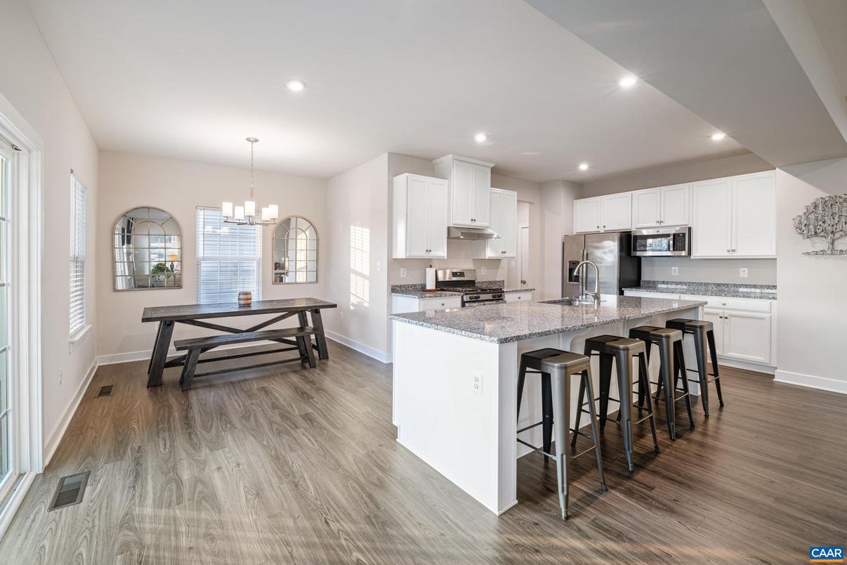 Chandelier, Dining room, Interior, Kitchen, Pendant Lights, Recessed Lighting, Stainless Steel Appliances, Wood Texture Flooring