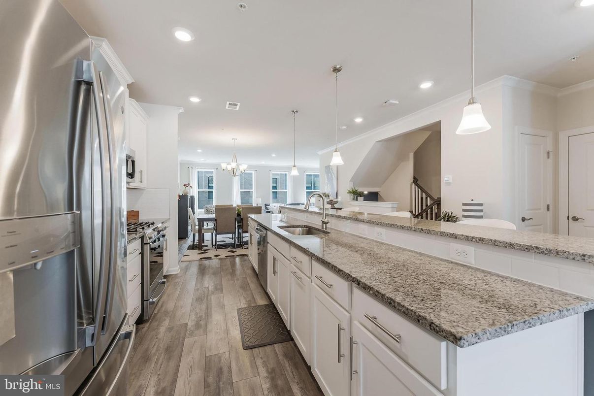 Chandelier, Dining room, Interior, Kitchen, Pendant Lights, Recessed Lighting, Stainless Steel Appliances, Wood Texture Flooring