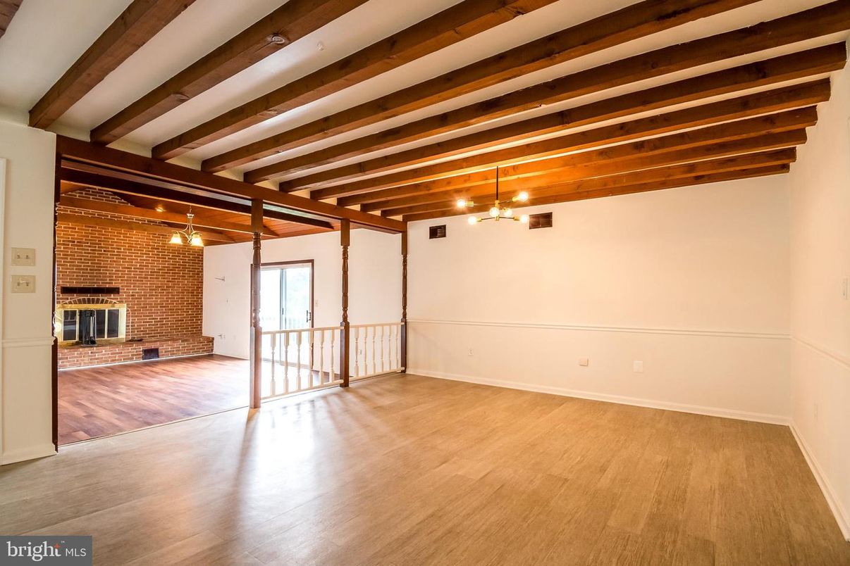 Empty room, Fireplace, Interior, Stone Walls, Wooden Beams, Wood Texture Flooring