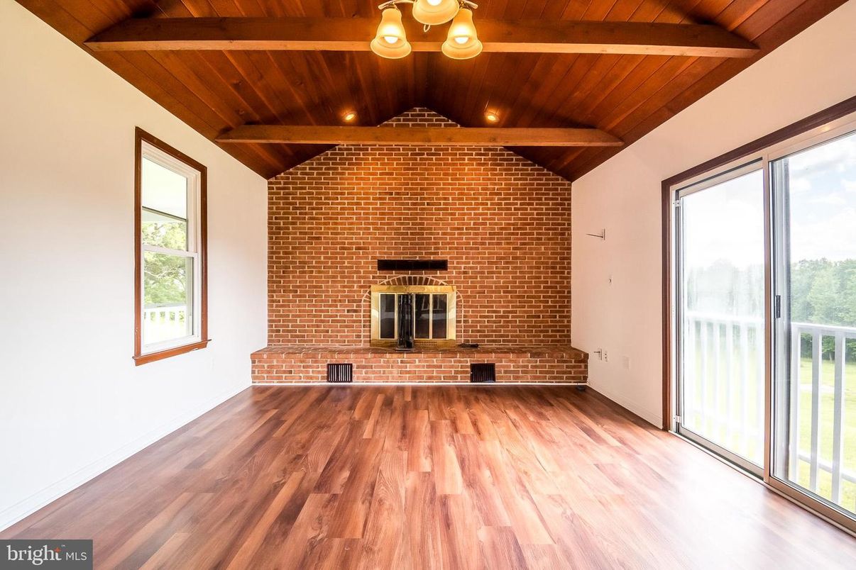 Empty room, Fireplace, Interior, Recessed Lighting, Stone Walls, Wooden Beams, Wooden Ceilings, Wood Texture Flooring