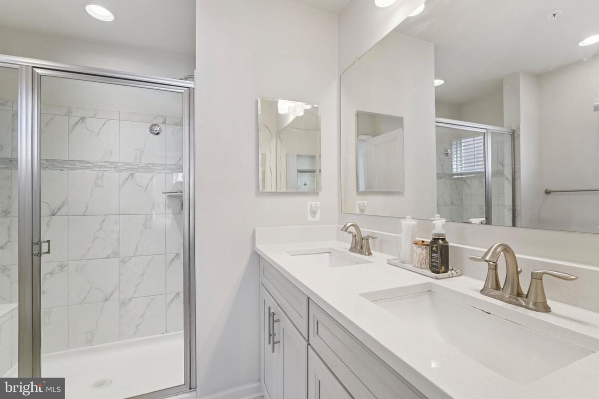 Bathroom, Dual Sink Vanities, Glass Shower, Interior, Marble Walls, Recessed Lighting