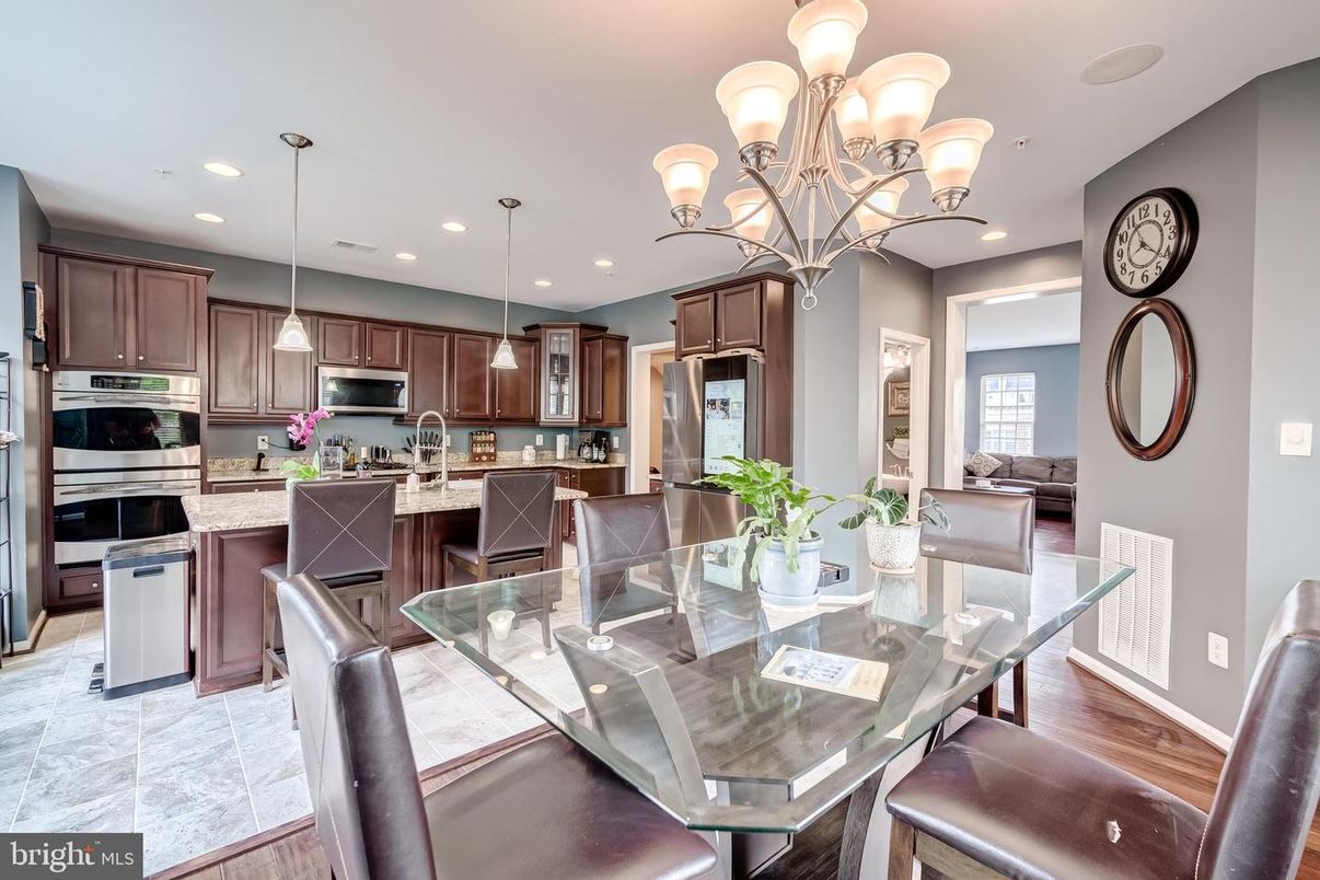 Chandelier, Dining room, Interior, Kitchen, Pendant Lights, Recessed Lighting, Stainless Steel Appliances, Wood Texture Flooring