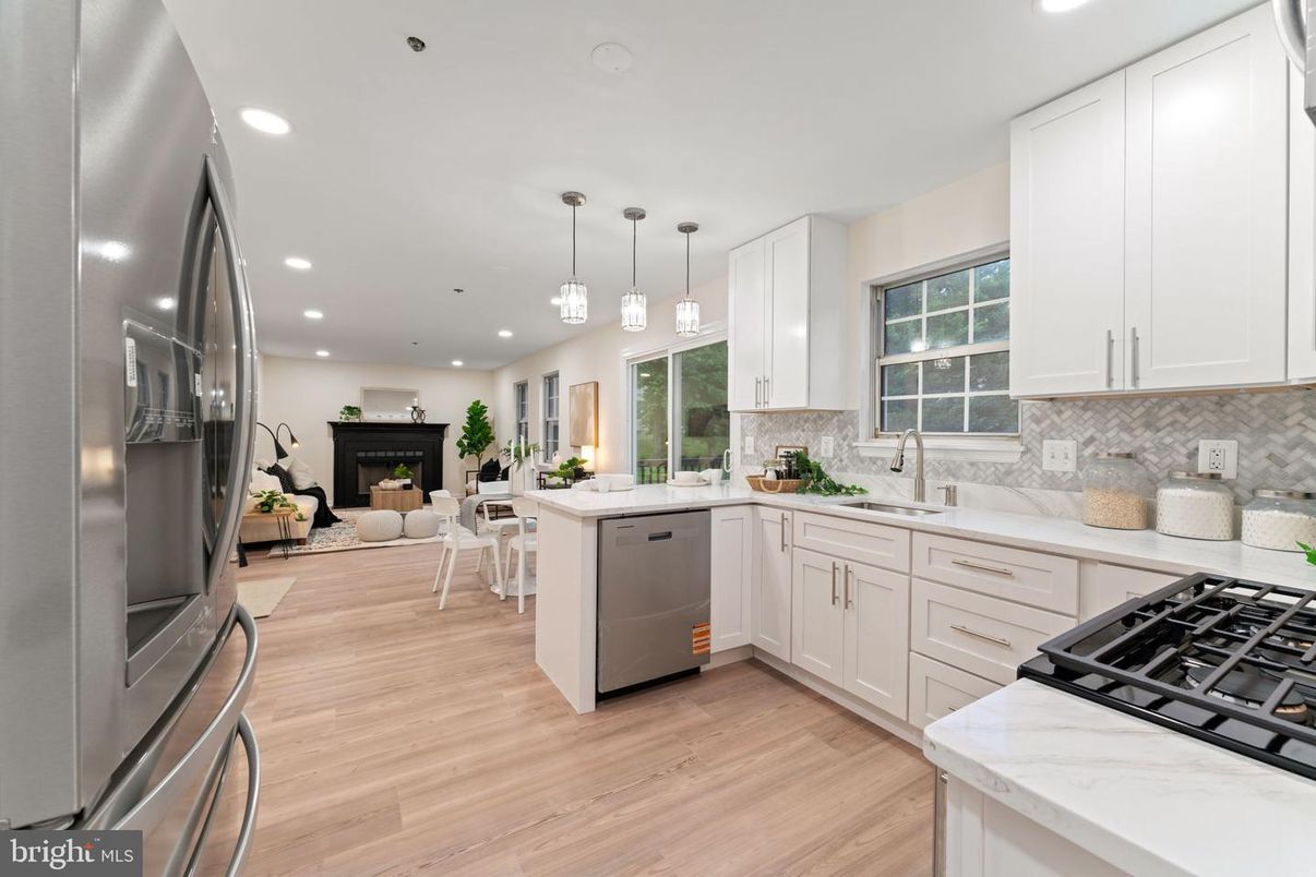 Dining room, Fireplace, Interior, Kitchen, Living room, Pendant Lights, Recessed Lighting, Stainless Steel Appliances, Wood Texture Flooring
