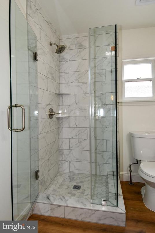 Bathroom, Glass Shower, Interior, Marble Walls, Wood Texture Flooring