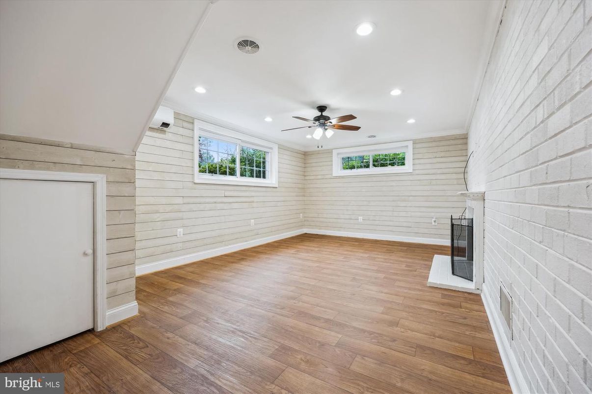 Empty room, Fireplace, Interior, Recessed Lighting, Stone Walls, Wood Texture Flooring