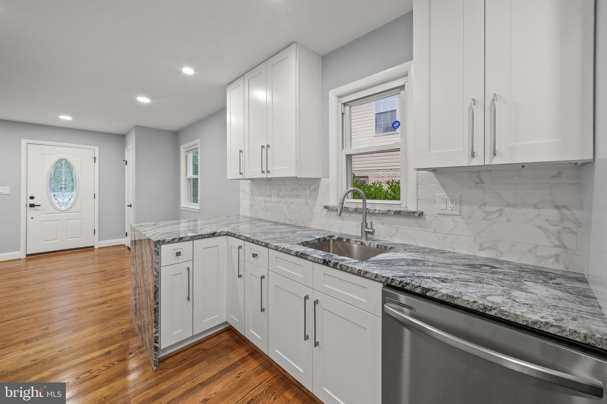 Interior, Kitchen, Marble Walls, Recessed Lighting, Stainless Steel Appliances, Wood Texture Flooring