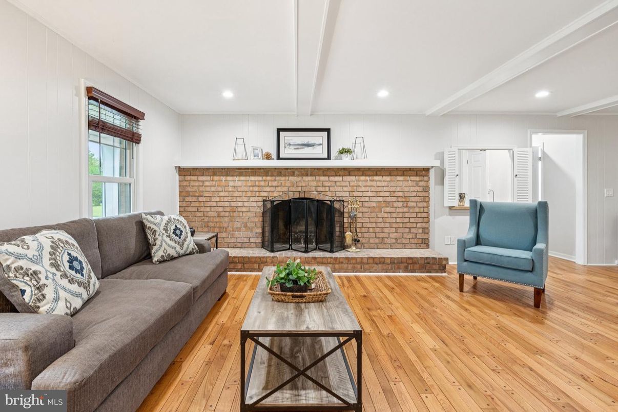 Fireplace, Interior, Living room, Recessed Lighting, Stone Walls, Wood Texture Flooring