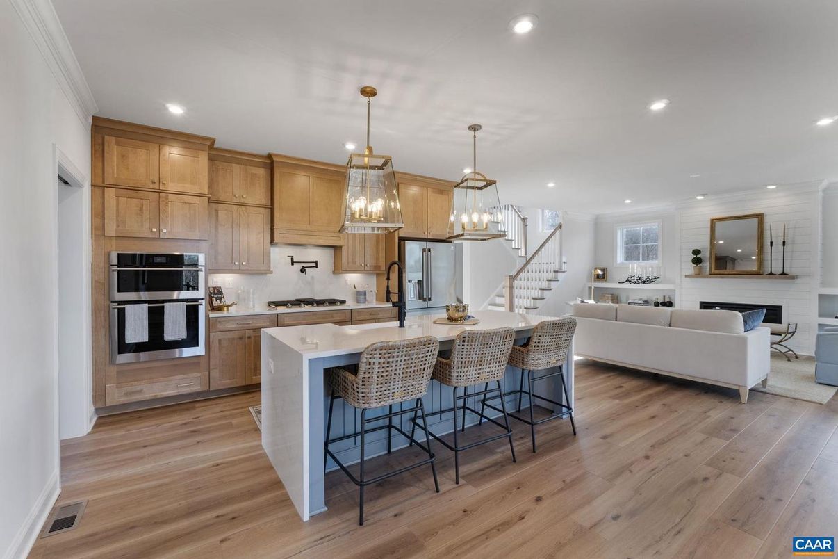 Fireplace, Interior, Kitchen, Living room, Pendant Lights, Recessed Lighting, Stainless Steel Appliances, Wood Texture Flooring