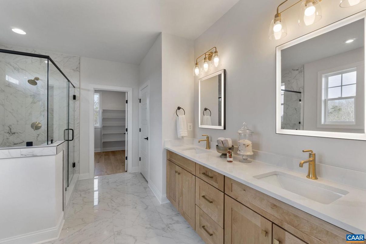 Bathroom, Dual Sink Vanities, Glass Shower, Interior, Marble, Marble Walls, Recessed Lighting, Walk-in Closets