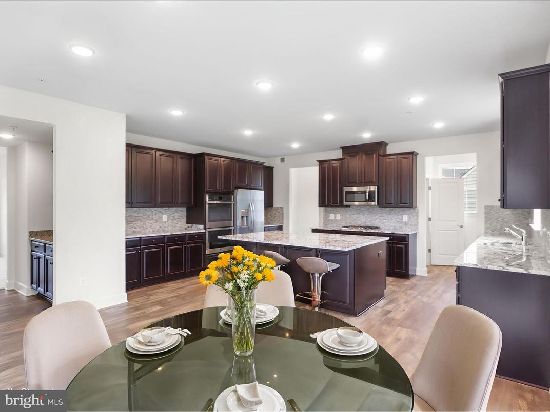 Dining room, Interior, Kitchen, Recessed Lighting, Stainless Steel Appliances, Wood Texture Flooring