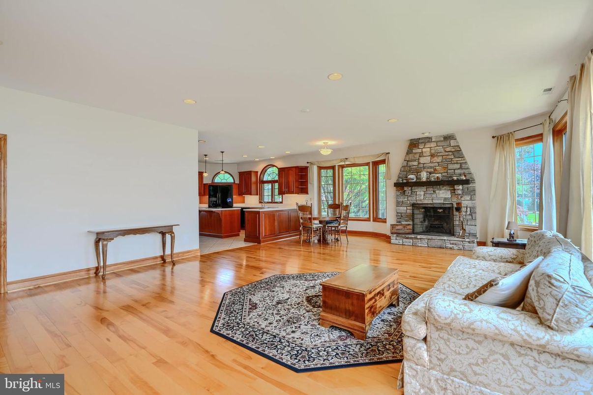 Dining room, Fireplace, Interior, Kitchen, Living room, Recessed Lighting, Stone Walls, Wood Texture Flooring