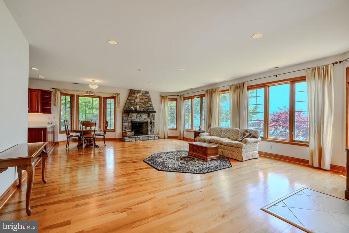 Dining room, Fireplace, Interior, Living room, Recessed Lighting, Wood Texture Flooring