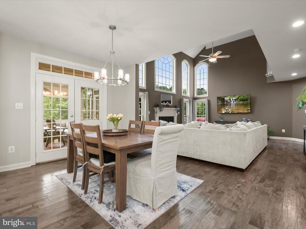 Dining room, Fireplace, Interior, Living room, Pendant Lights, Recessed Lighting, Wood Texture Flooring