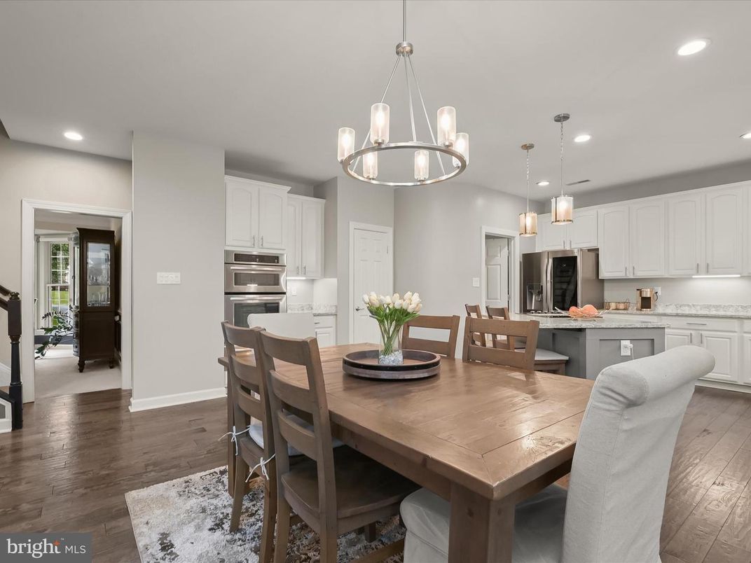 Chandelier, Dining room, Interior, Kitchen, Pendant Lights, Recessed Lighting, Stainless Steel Appliances, Wood Texture Flooring