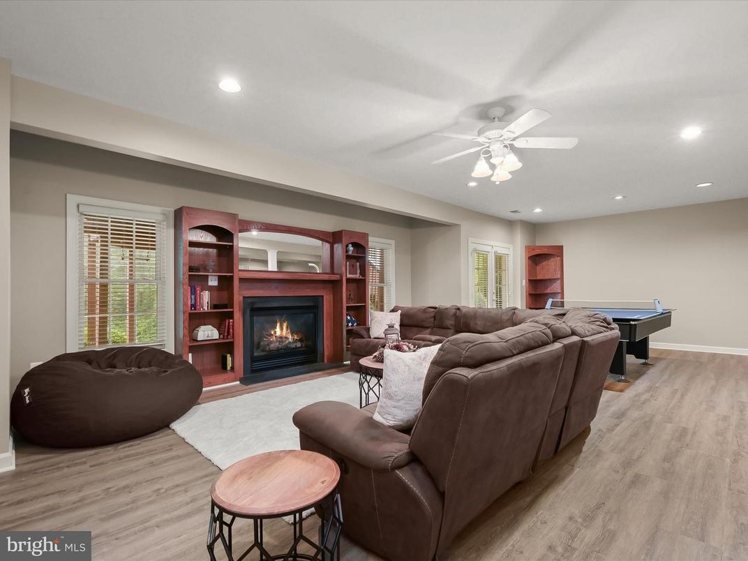 Billiard Table, Fireplace, Game Room, Interior, Living room, Recessed Lighting, Wood Texture Flooring