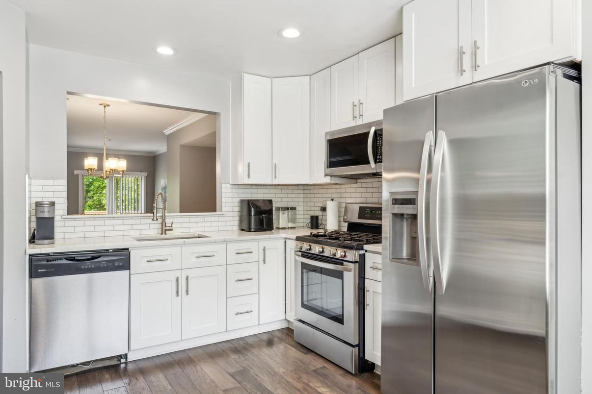 Chandelier, Interior, Kitchen, Pendant Lights, Recessed Lighting, Stainless Steel Appliances, Wood Texture Flooring