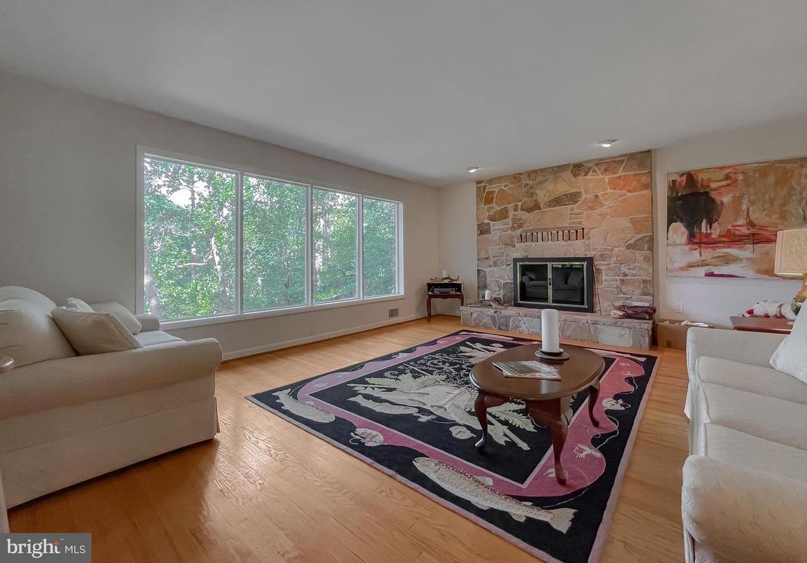 Fireplace, Interior, Living room, Recessed Lighting, Stone Walls, Wood Texture Flooring
