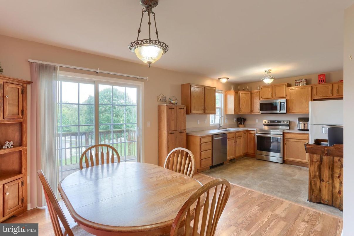Dining room, Interior, Kitchen, Pendant Lights, Stainless Steel Appliances, Wood Texture Flooring