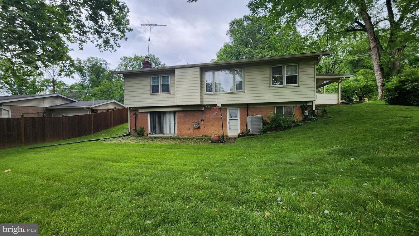 Attached, Backyard, Exterior, Facade, Brick Facade, Raised Ranch