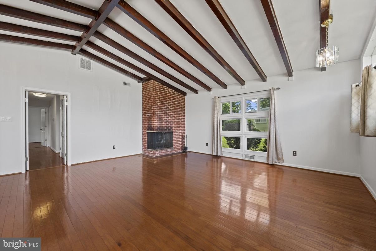 Empty room, Fireplace, Interior, Stone Walls, Wooden Beams, Wood Texture Flooring