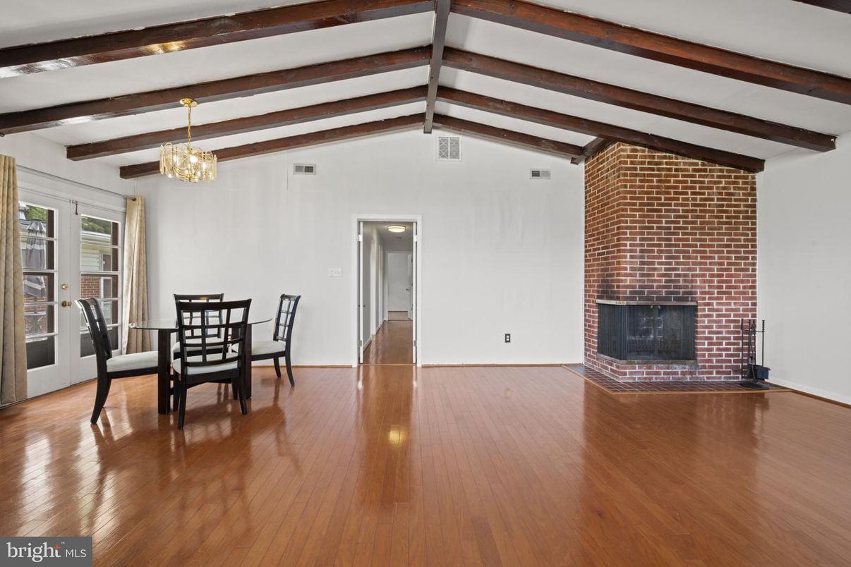 Chandelier, Dining room, Fireplace, Interior, Stone Walls, Wooden Beams, Wood Texture Flooring