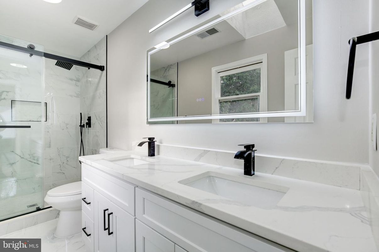 Bathroom, Dual Sink Vanities, Glass Shower, Interior, Marble, Marble Walls, Recessed Lighting