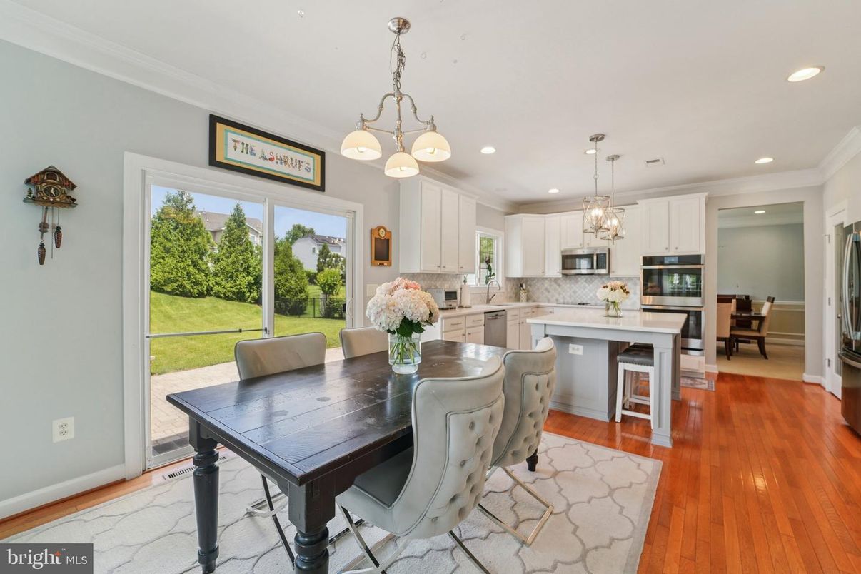 Dining room, Interior, Kitchen, Pendant Lights, Recessed Lighting, Stainless Steel Appliances, Wood Texture Flooring