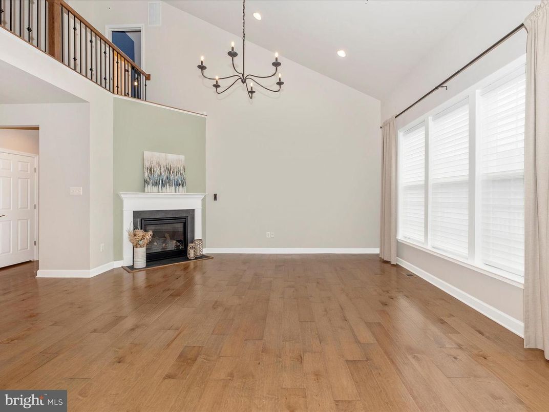 Chandelier, Empty room, Fireplace, Interior, Recessed Lighting, Wood Texture Flooring