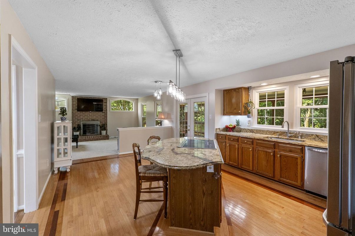 Dining room, Fireplace, Interior, Kitchen, Pendant Lights, Wood Texture Flooring
