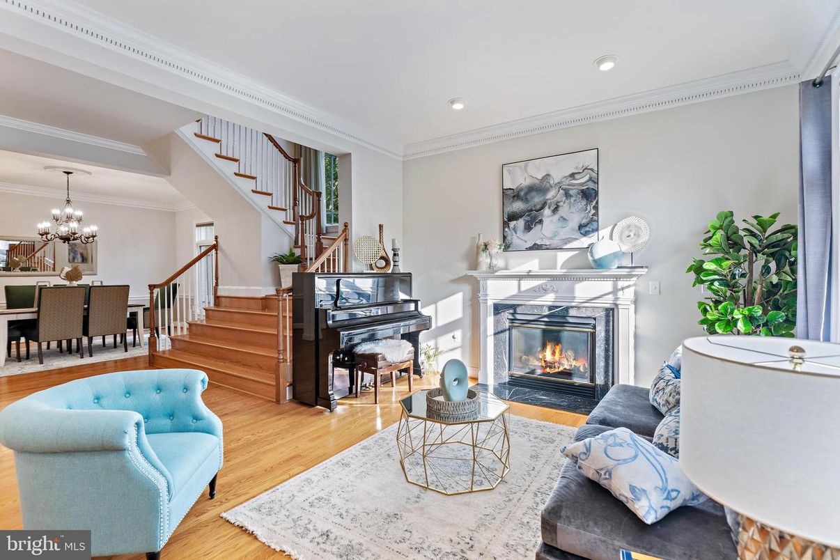 Chandelier, Dining room, Fireplace, Interior, Living room, Piano, Recessed Lighting, Wood Texture Flooring