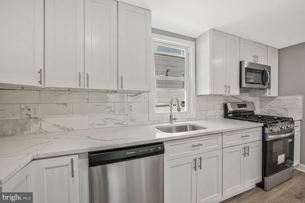 Interior, Kitchen, Marble Walls, Stainless Steel Appliances, Wood Texture Flooring