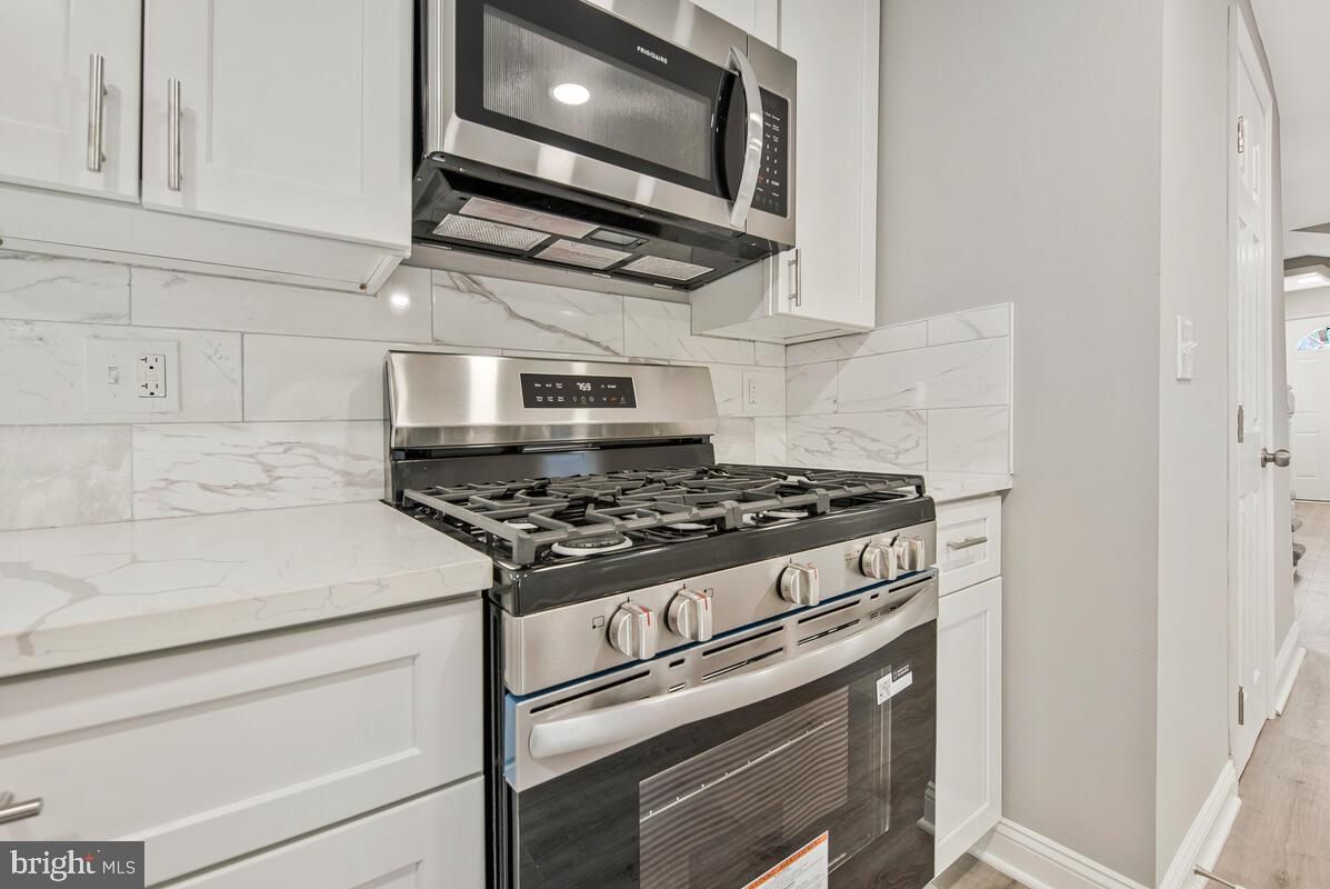 Interior, Kitchen, Marble Walls, Stainless Steel Appliances, Wood Texture Flooring
