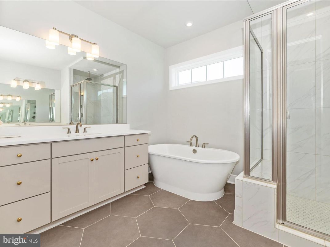 Bathroom, Dual Sink Vanities, Free Standing Baths, Glass Shower, Interior, Marble Walls, Recessed Lighting