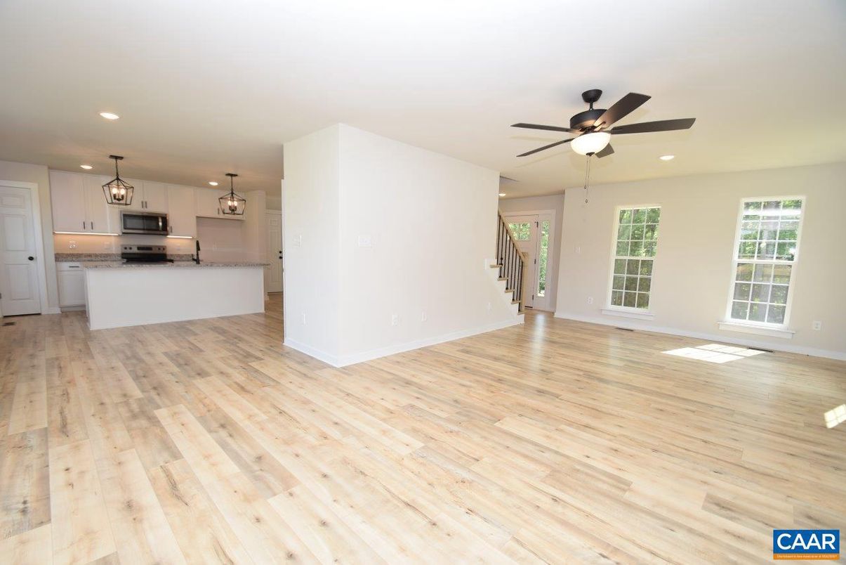 Empty room, Interior, Kitchen, Pendant Lights, Recessed Lighting, Stainless Steel Appliances, Wood Texture Flooring