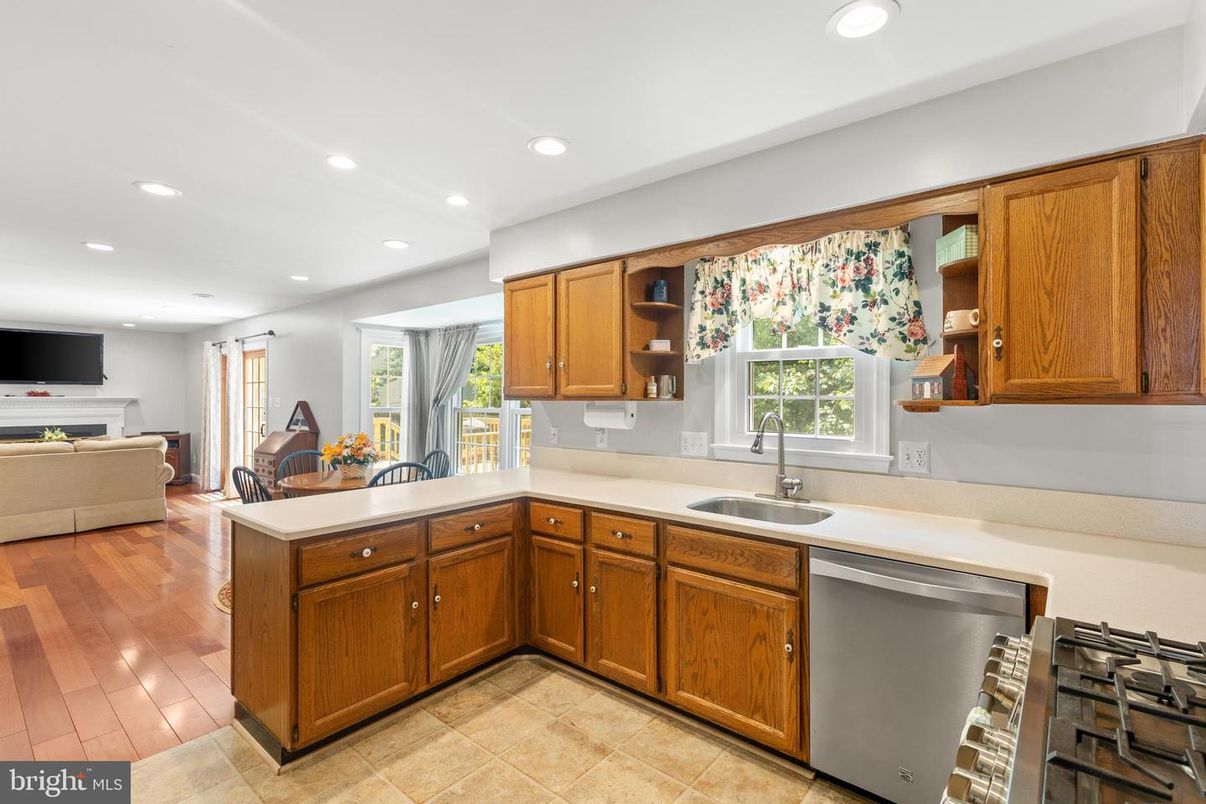 Fireplace, Interior, Kitchen, Recessed Lighting, Stainless Steel Appliances, Wood Texture Flooring