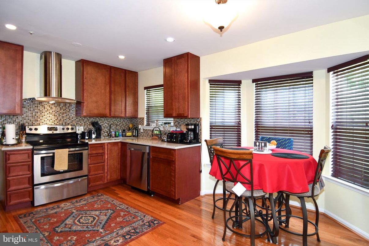 Dining room, Interior, Kitchen, Recessed Lighting, Stainless Steel Appliances, Wood Texture Flooring