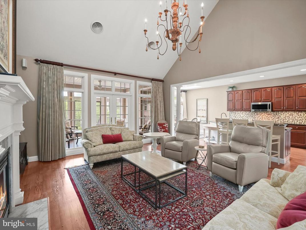 Chandelier, Fireplace, Interior, Kitchen, Living room, Recessed Lighting, Wood Texture Flooring