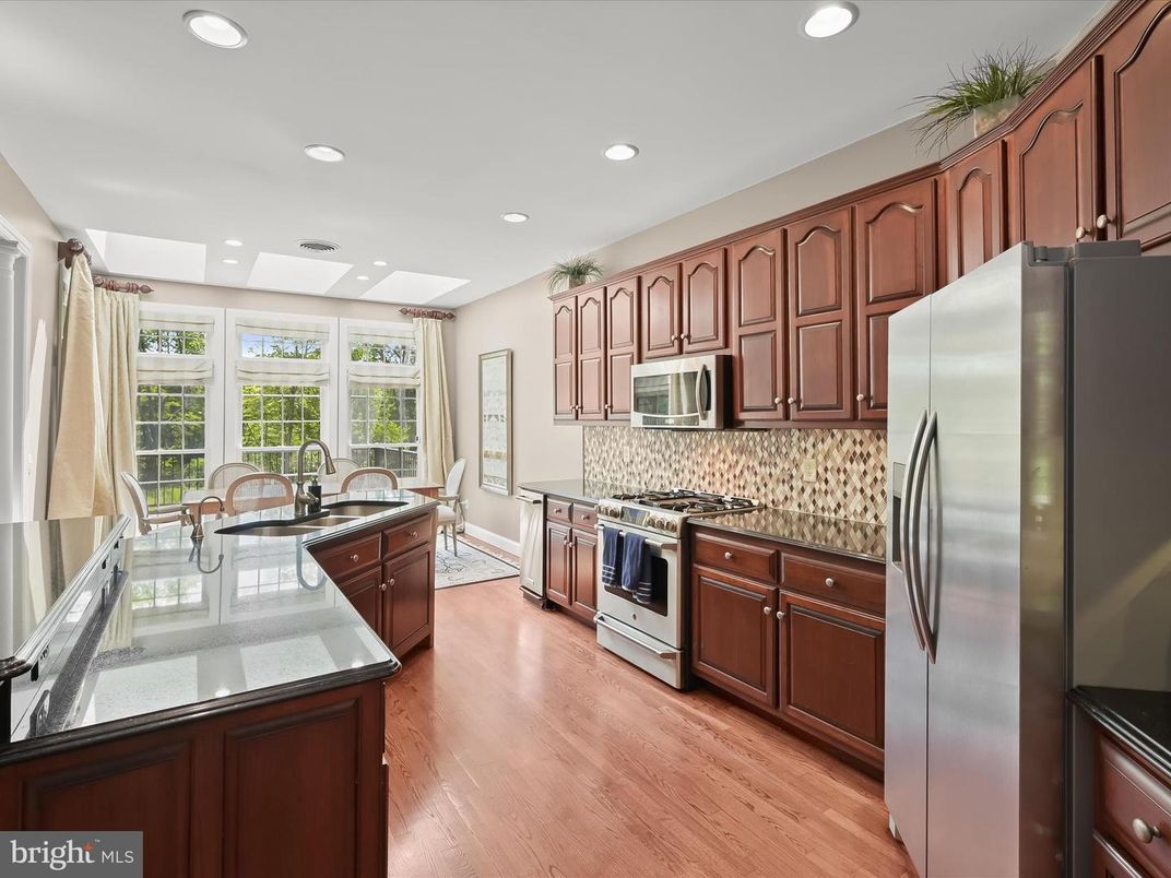 Dining room, Interior, Kitchen, Recessed Lighting, Stainless Steel Appliances, Wood Texture Flooring