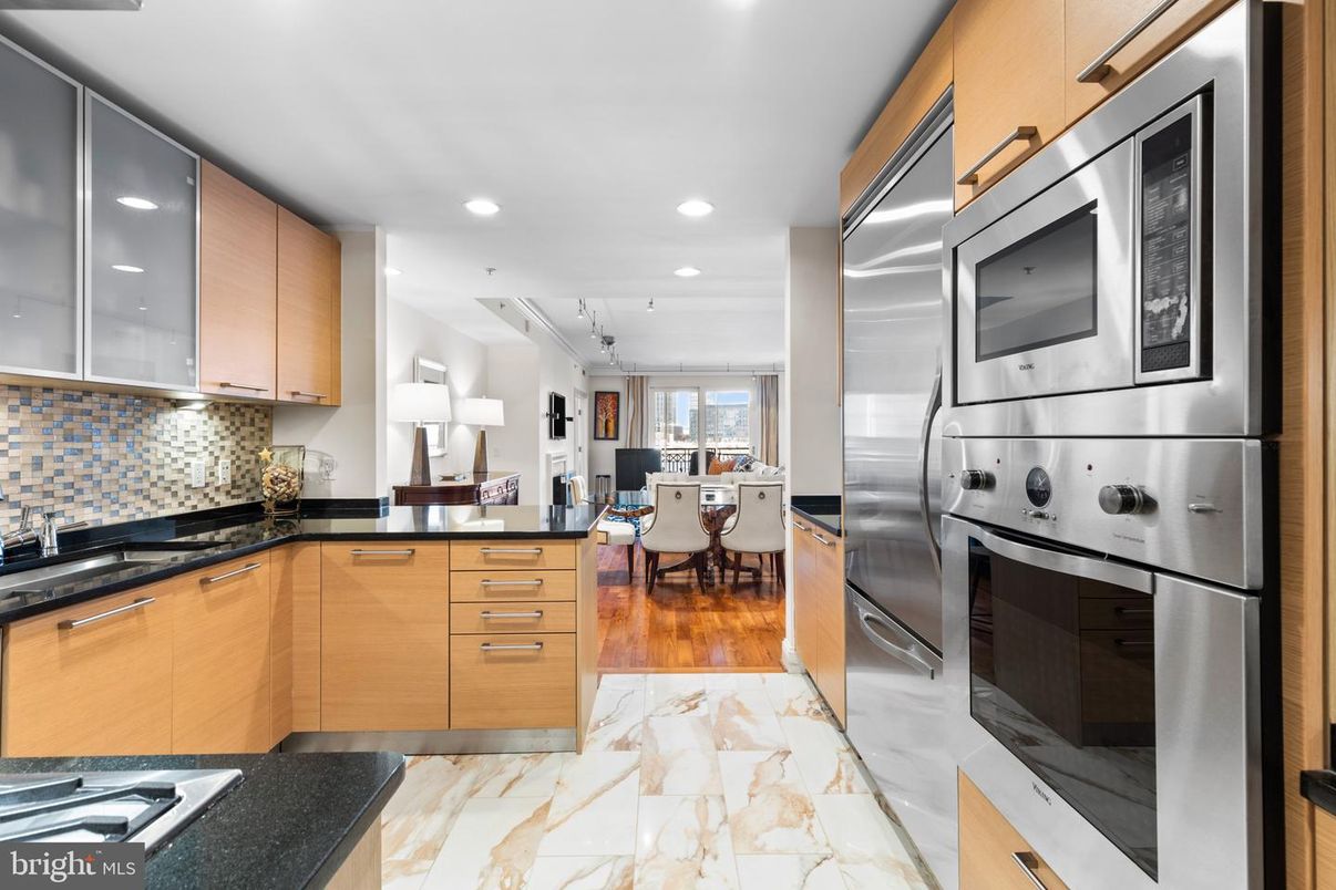 Dining room, Interior, Kitchen, Marble, Recessed Lighting, Stainless Steel Appliances, Wood Texture Flooring