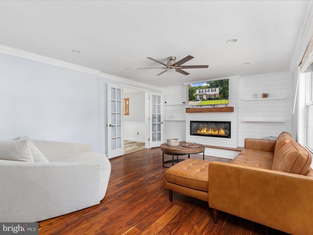 Fireplace, Interior, Living room, Recessed Lighting, Stone Walls, Wood Texture Flooring