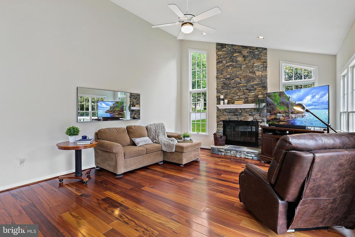 Fireplace, Interior, Living room, Recessed Lighting, Stone Walls, Wood Texture Flooring