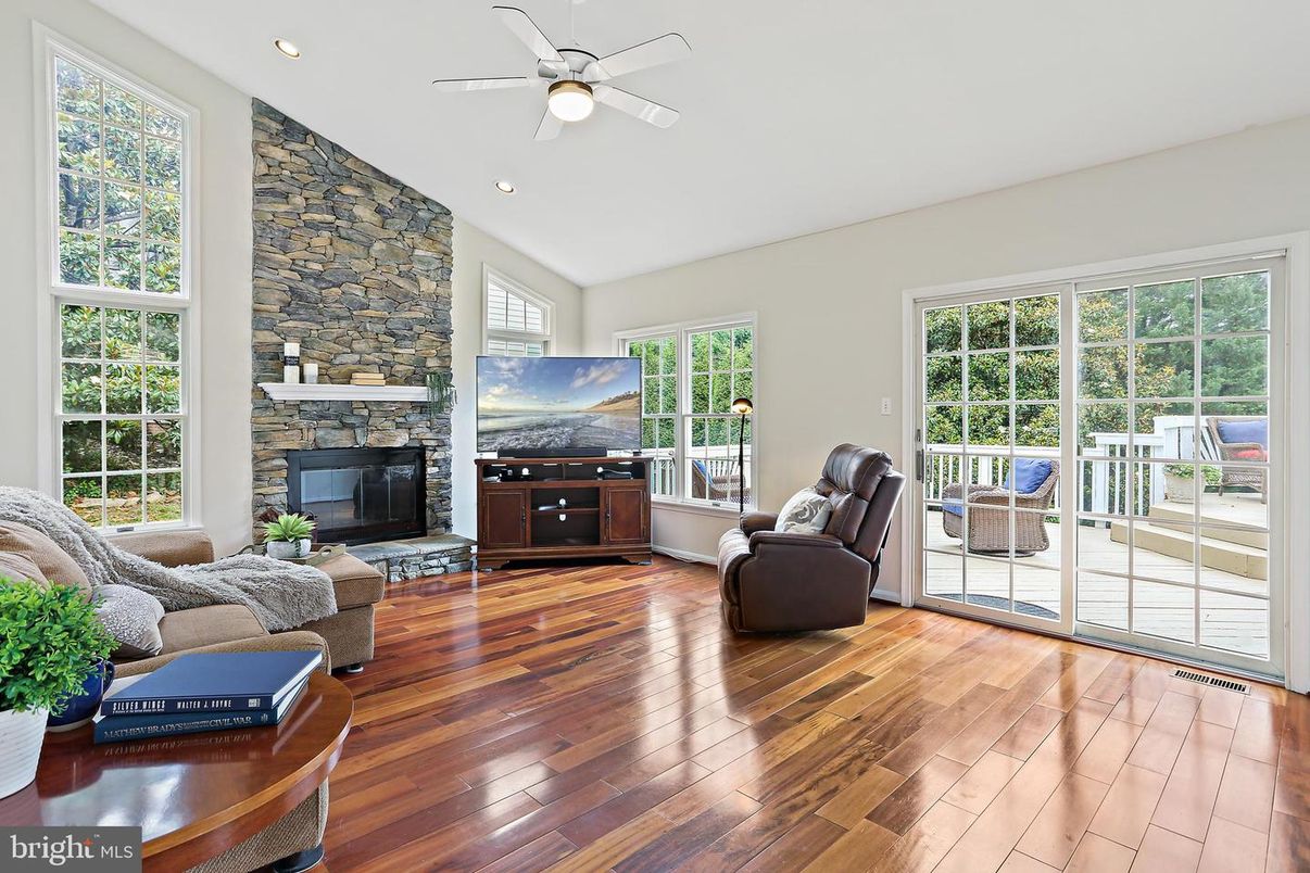 Fireplace, Interior, Living room, Recessed Lighting, Stone Walls, Wood Texture Flooring