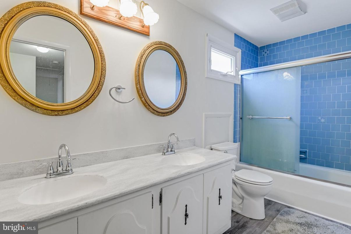 Bathroom, Dual Sink Vanities, Glass Shower, Interior, Wood Texture Flooring