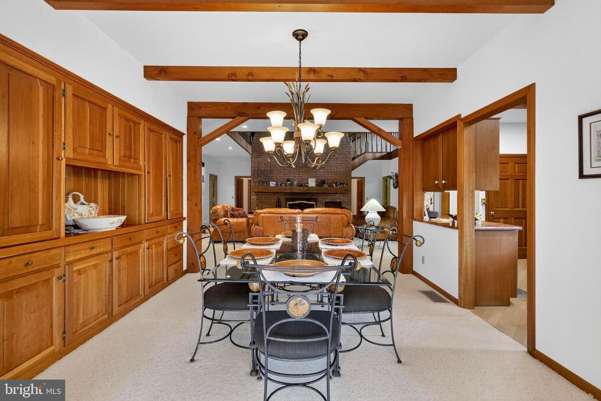 Chandelier, Dining room, Fireplace, Interior, Wooden Beams