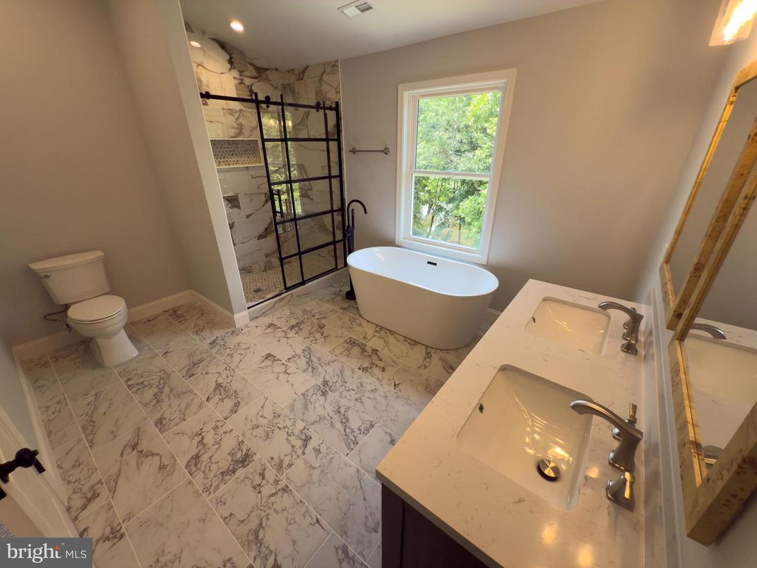 Bathroom, Dual Sink Vanities, Free Standing Baths, Glass Shower, Interior, Marble, Marble Walls, Recessed Lighting