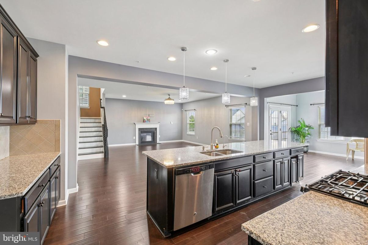 Fireplace, Interior, Kitchen, Pendant Lights, Recessed Lighting, Stainless Steel Appliances, Wood Texture Flooring