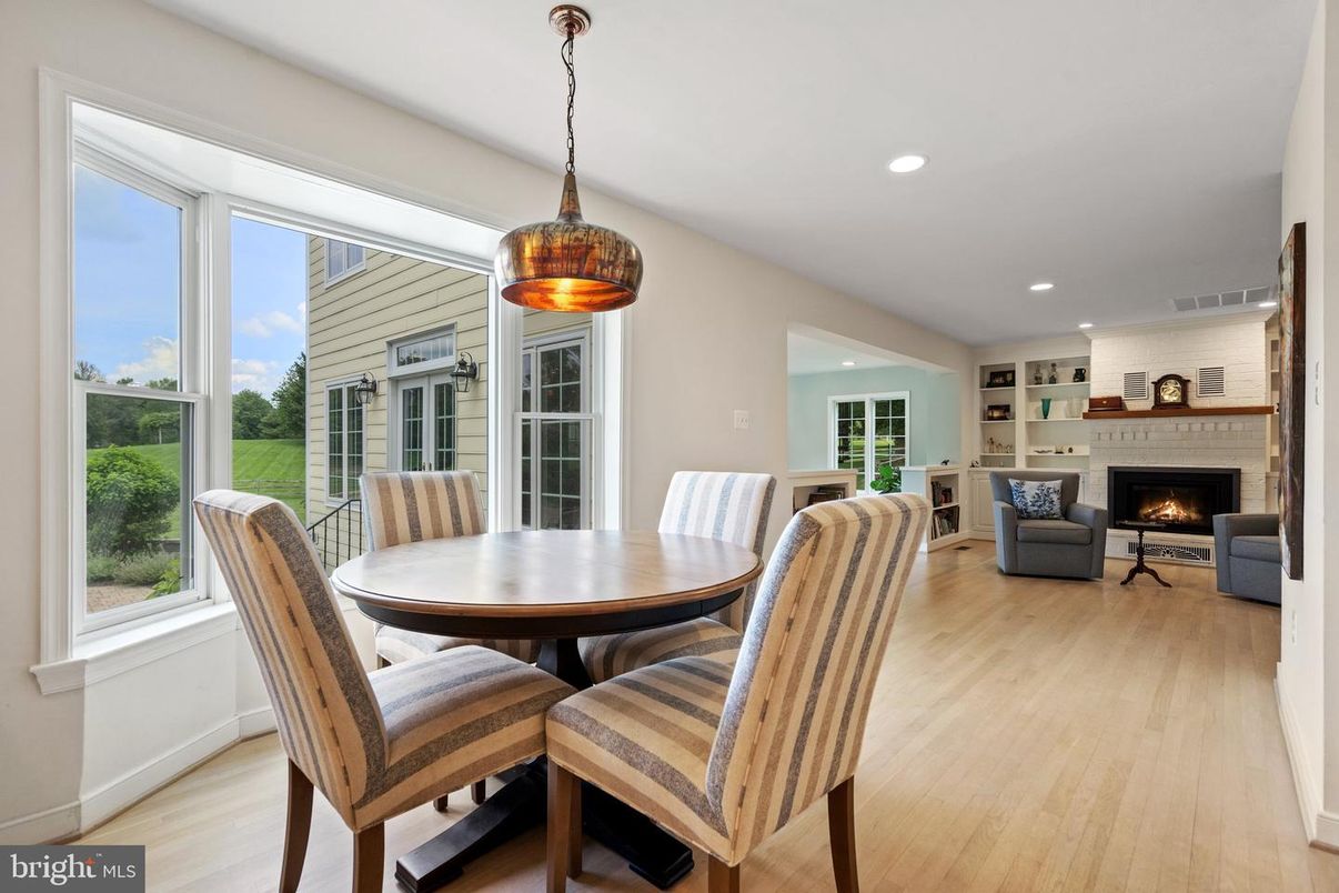 Dining room, Fireplace, Interior, Living room, Pendant Lights, Recessed Lighting, Wood Texture Flooring