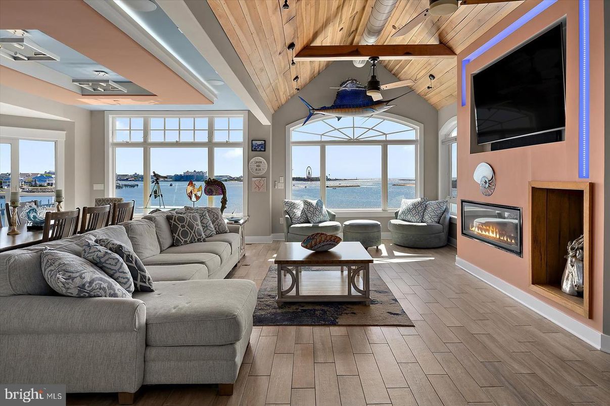 Dining room, Fireplace, Interior, Living room, Water, Wooden Ceilings, Wood Texture Flooring